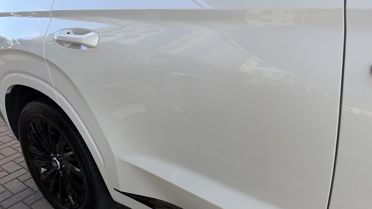 Side panel of a white SUV